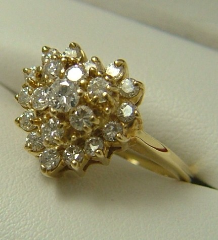 Appraisal: DIAMOND AND FOURTEEN KARAT GOLD CLUSTER RING set with round-cut