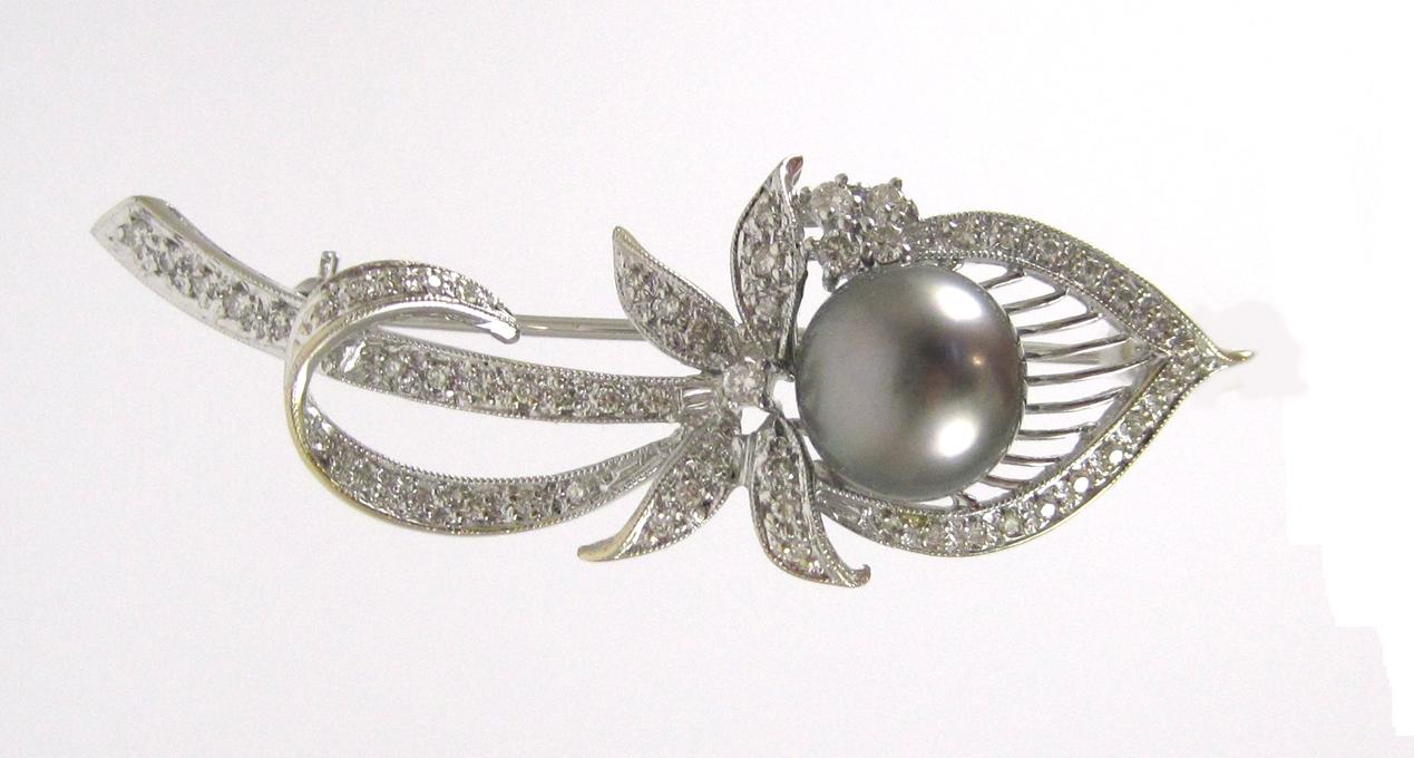 Appraisal: TAHITIAN BLACK PEARL AND DIAMOND BROOCH k white gold with