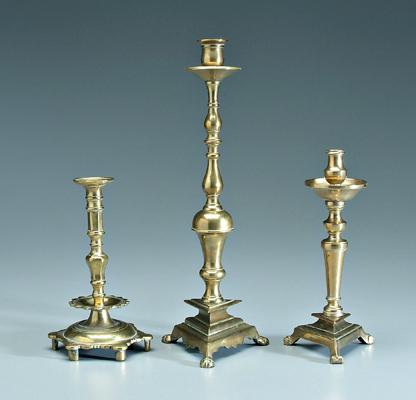 Appraisal: Three footed brass candlesticks all of heavy cast construction two