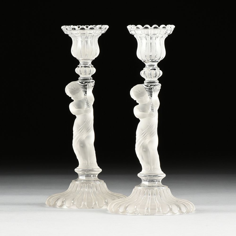 Appraisal: A PAIR OF BACCARAT FROSTED CRYSTAL FIGURAL CANDLESTICKS SIGNED EARLY