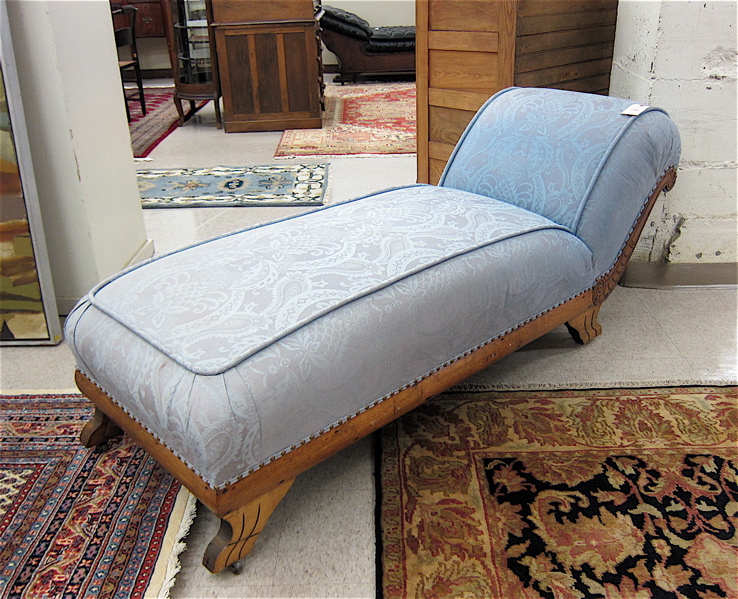 Appraisal: LATE VICTORIAN CARVED AND UPHOLSTERED OAK CHAISE LOUNGE American late