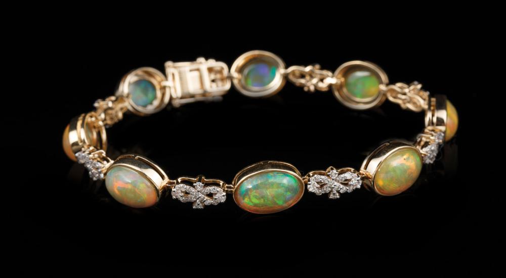 Appraisal: kt Yellow Gold Opal and Diamond Bracelet bezel set oval