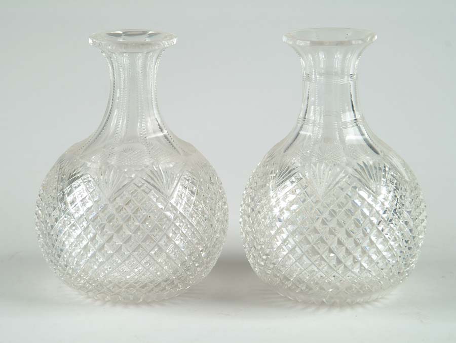 Appraisal: PAIR OF CUT GLASS DECANTERS Waffle design with cut fans