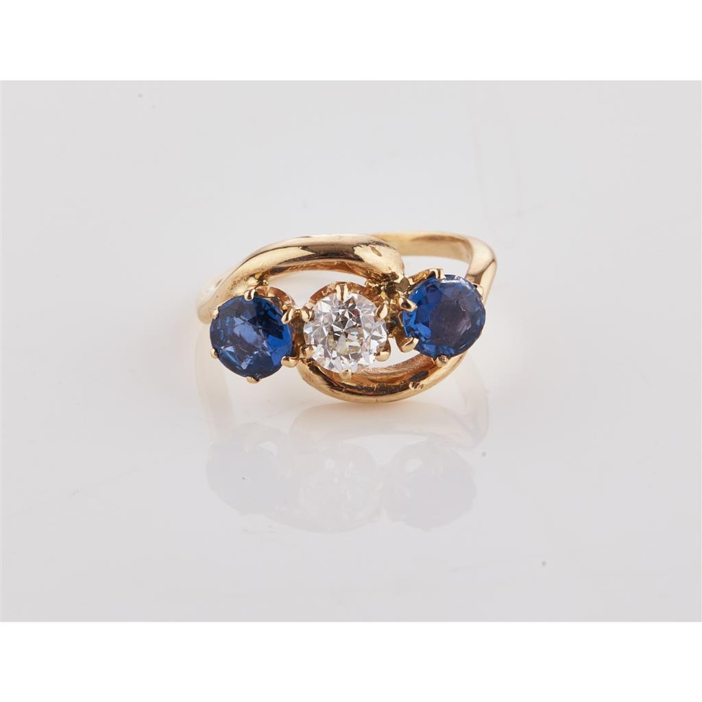 Appraisal: A sapphire and diamond set three stone ring claw set