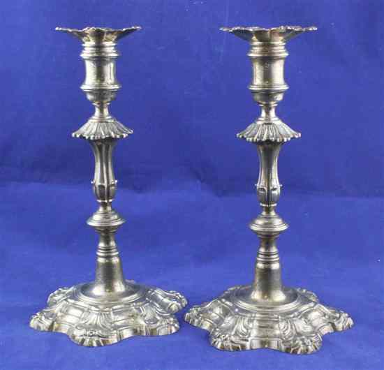 Appraisal: A pair of George II cast silver candlesticks with waisted