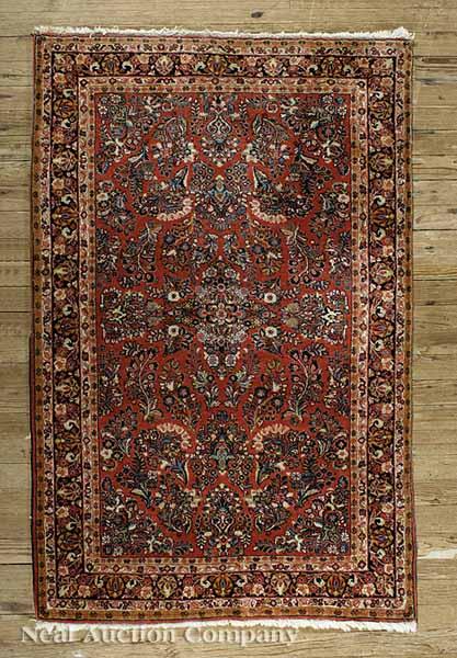 Appraisal: An Antique Persian Rug red ground overall stylized floral motifs