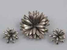 Appraisal: A suite of Danish silver jewellery comprising a brooch designed