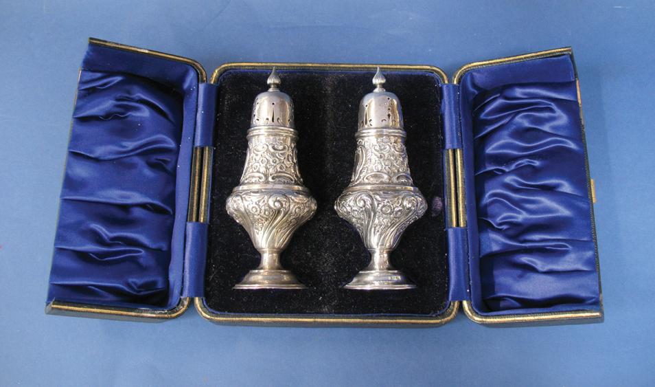 Appraisal: A PAIR OF EDWARDIAN SUGAR CASTORS of baluster form with