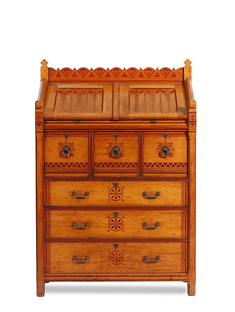 Appraisal: A VICTORIAN GOTHIC REVIVAL PITCH PINE CHEST OF DRAWERS by