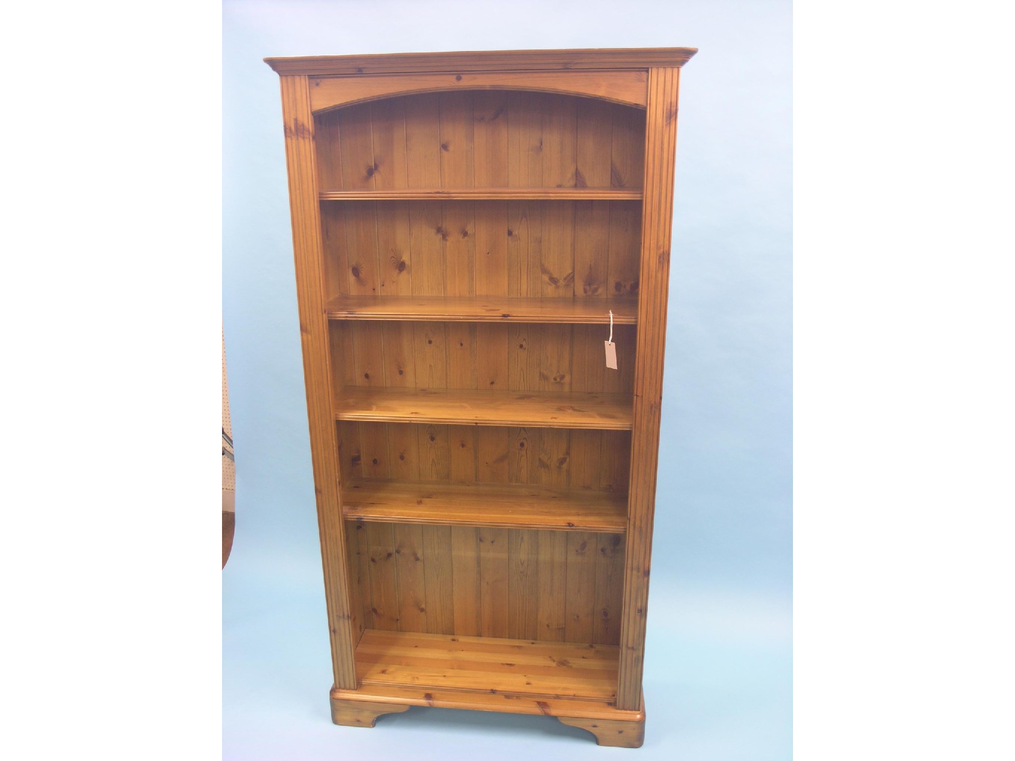 Appraisal: A modern waxed pine open bookcase floor-standing four adjustable shelves