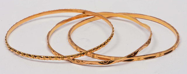 Appraisal: Collection of three ct gold braceletsIranian g the three