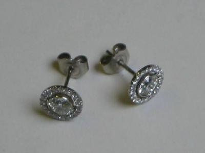 Appraisal: A PAIR OF DIAMOND EARRINGS of stud form the central