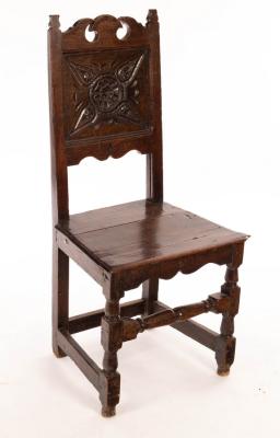 Appraisal: A th Century style oak chair with carved panel to