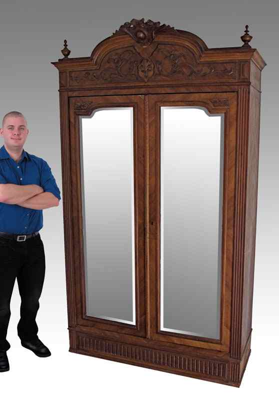 Appraisal: LARGE FRENCH ARMOIRE WITH MIRROR DOORS Carved crest with applied