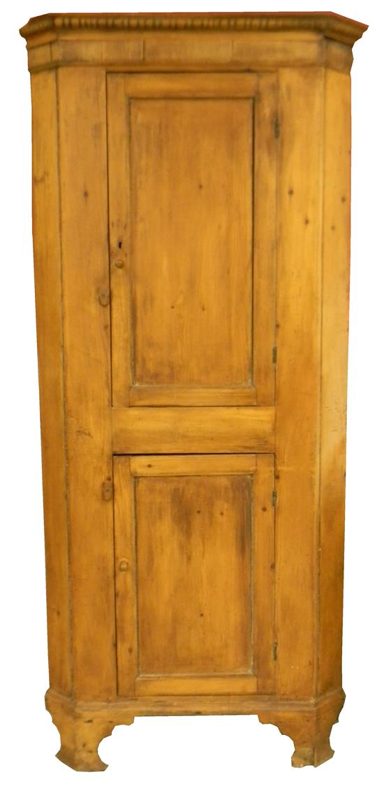 Appraisal: Antique corner cabinet pine stripped to natural finish projecting cornice