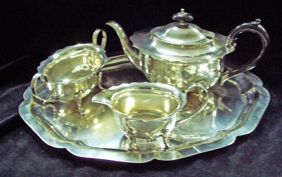 Appraisal: An oval three-piece tea service and an oval tray