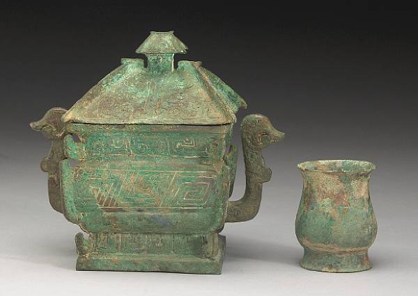 Appraisal: Two cast bronzes vessels The first a small Zhou Dynasty