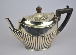 Appraisal: A late Victorian silver oval half-reeded teapot James Dixon Sons