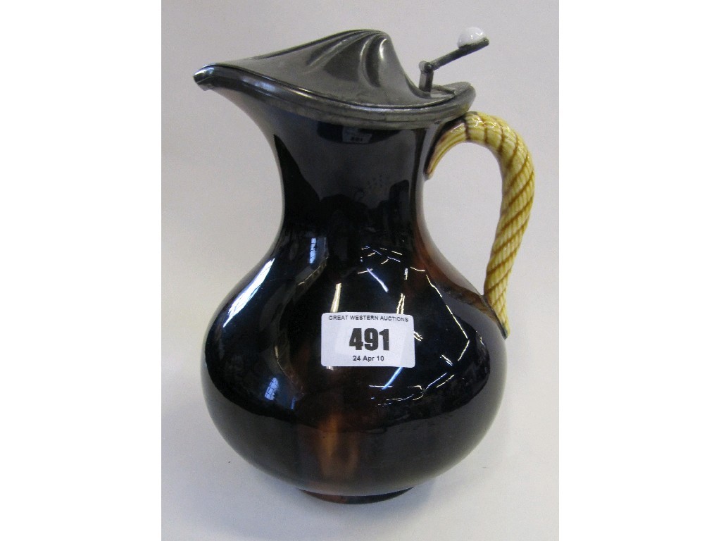 Appraisal: Wedgwood treacle glazed jug with rope twist handle and pewter