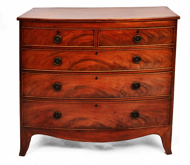 Appraisal: A VICTORIAN MAHOGANY BOW FRONT CHEST of two short and