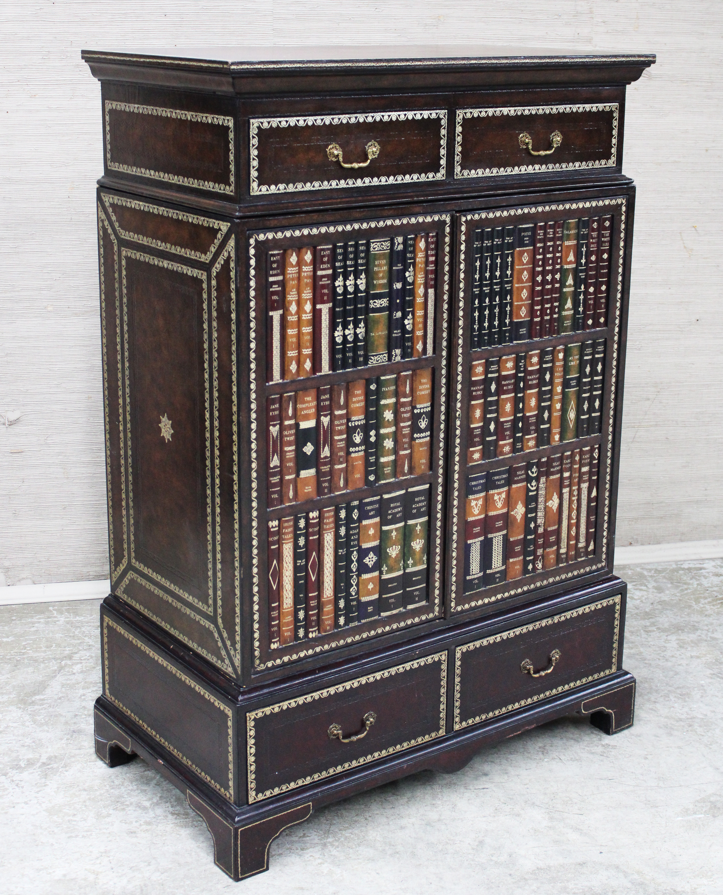 Appraisal: MAITLAND SMITH Maitland Smith embossed leather bookcase cabinet with faux