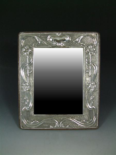 Appraisal: ART NOUVEAU STRUT MIRROR DATED silver with oak back embossed