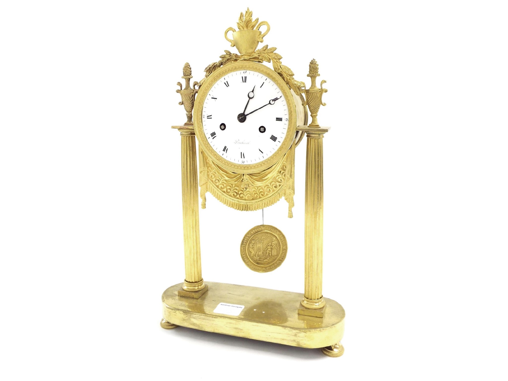 Appraisal: French ormolu two train Empire style pillar clock the movement