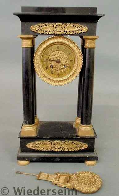 Appraisal: French black onyx and ebonized wood portico shelf clock with