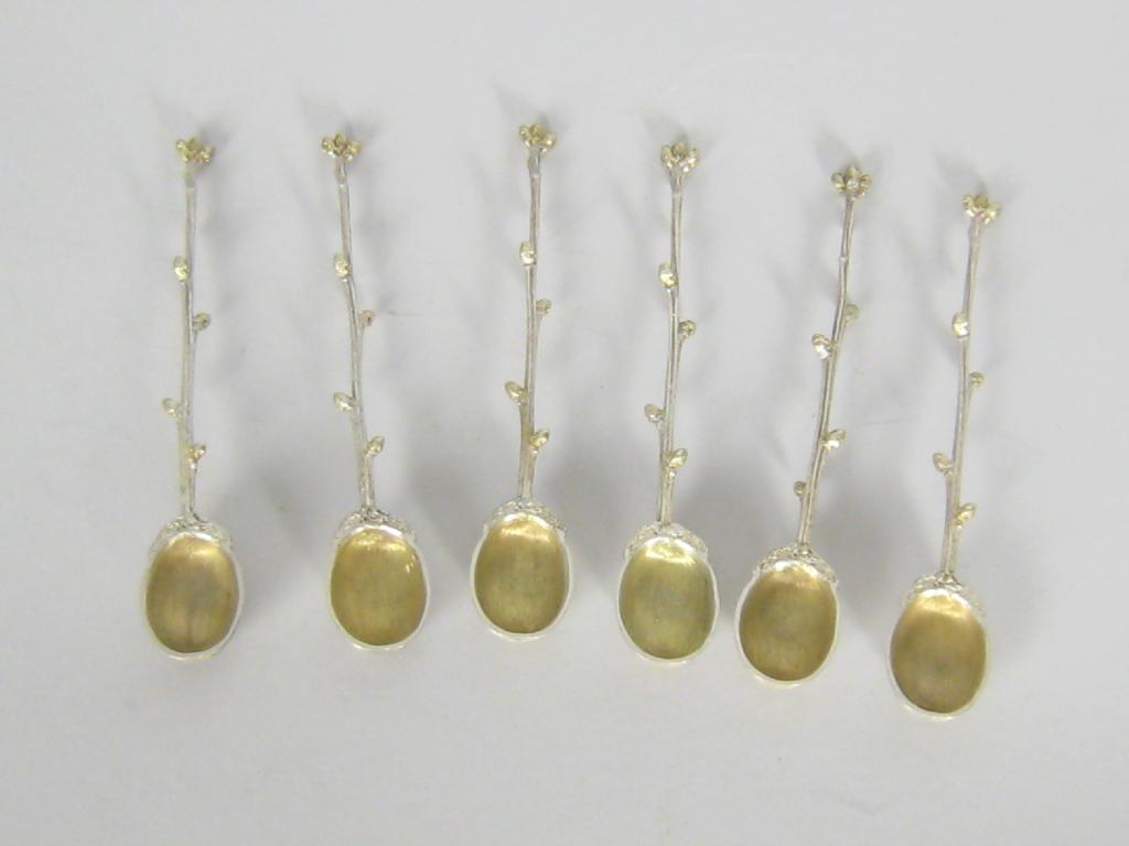 Appraisal: A set of six modern cast silver-gilt Teaspoons with acorn