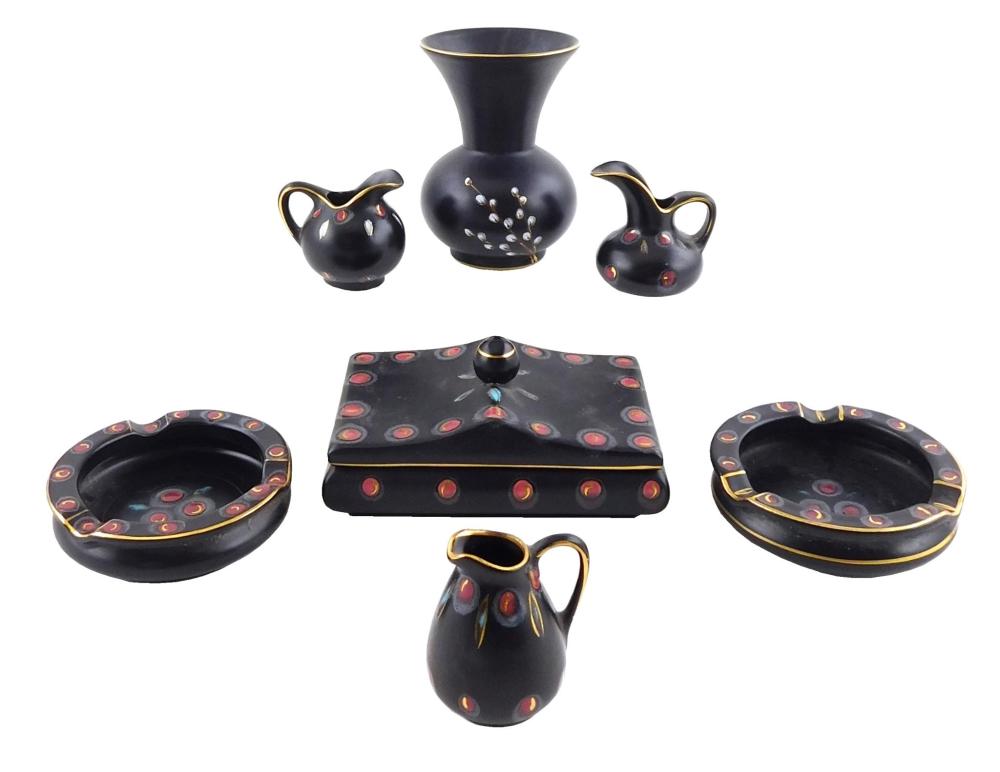 Appraisal: ART POTTERY Gouda Zwaro pattern seven pieces black ground with