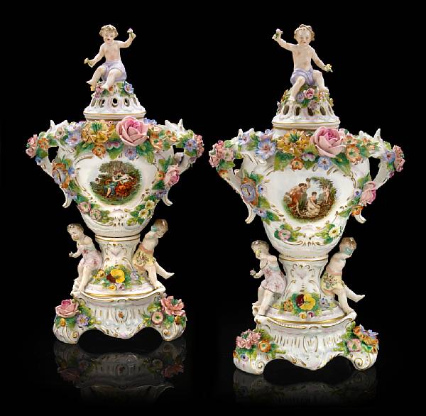 Appraisal: A pair of German floral encrusted porcelain potpourri urns early