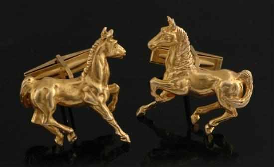 Appraisal: A pair of gold horse cufflinks Each cufflink comprising a