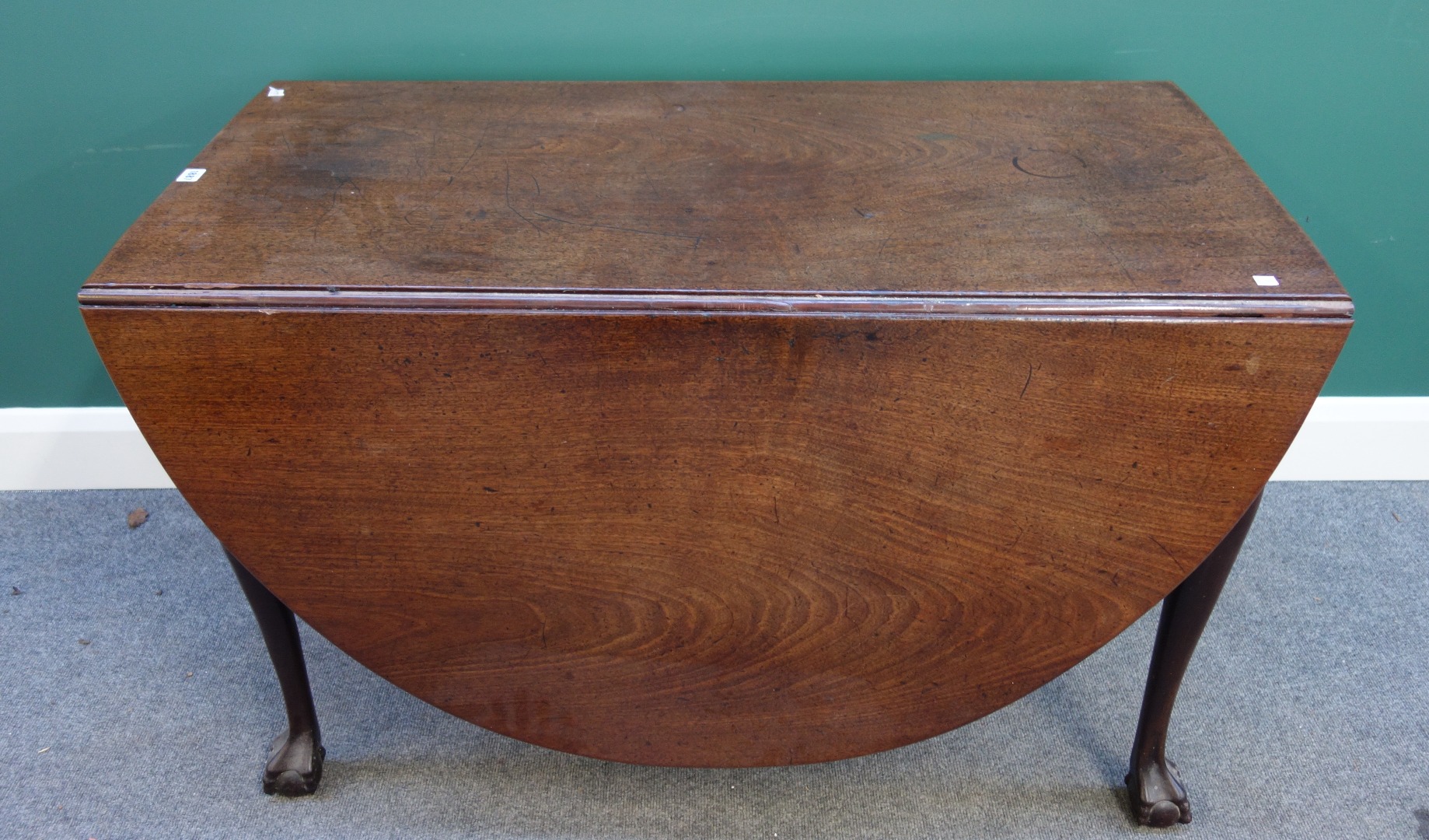 Appraisal: A mid th century mahogany drop flap dining table the