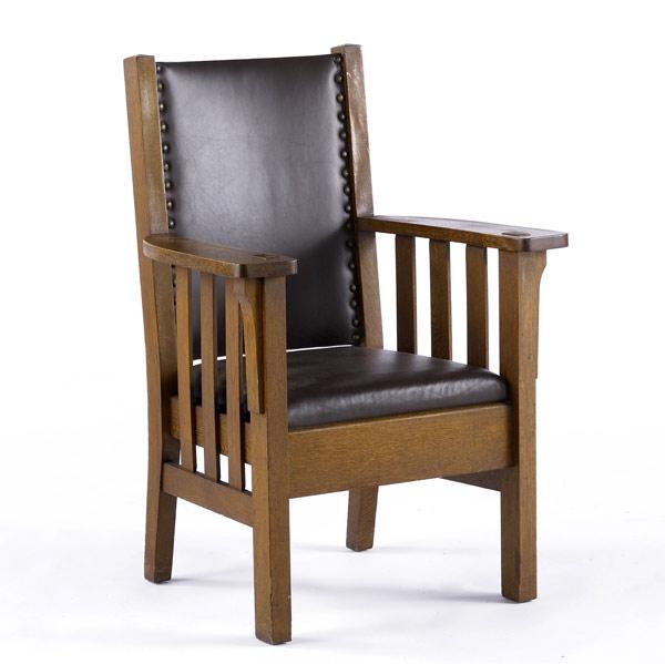 Appraisal: HARDEN Armchair with slatted sides drop-in seat recovered in brown