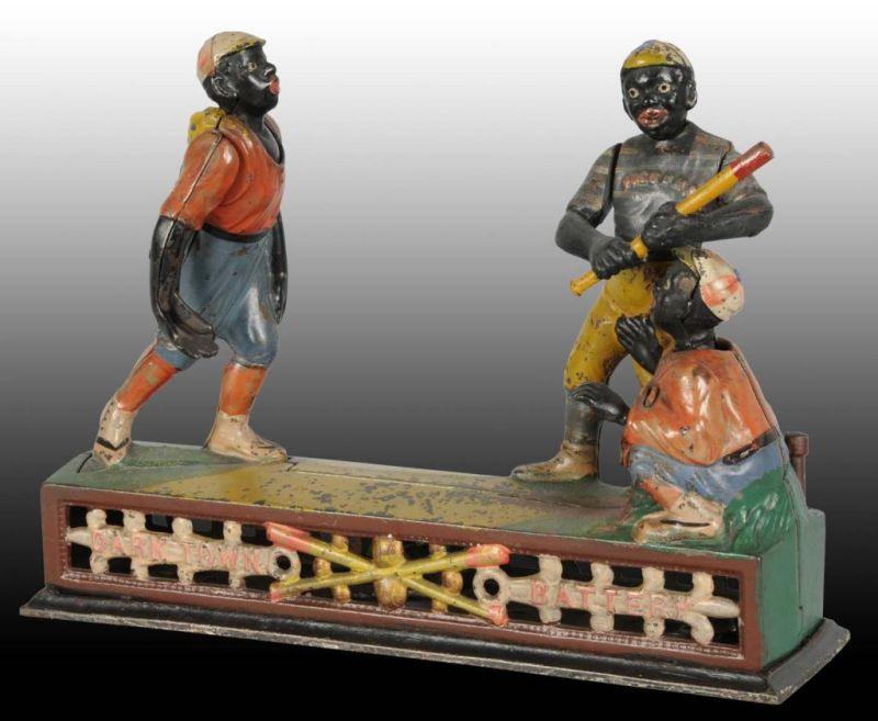 Appraisal: Cast Iron Darktown Battery Mechanical Bank Description Manufactured by J