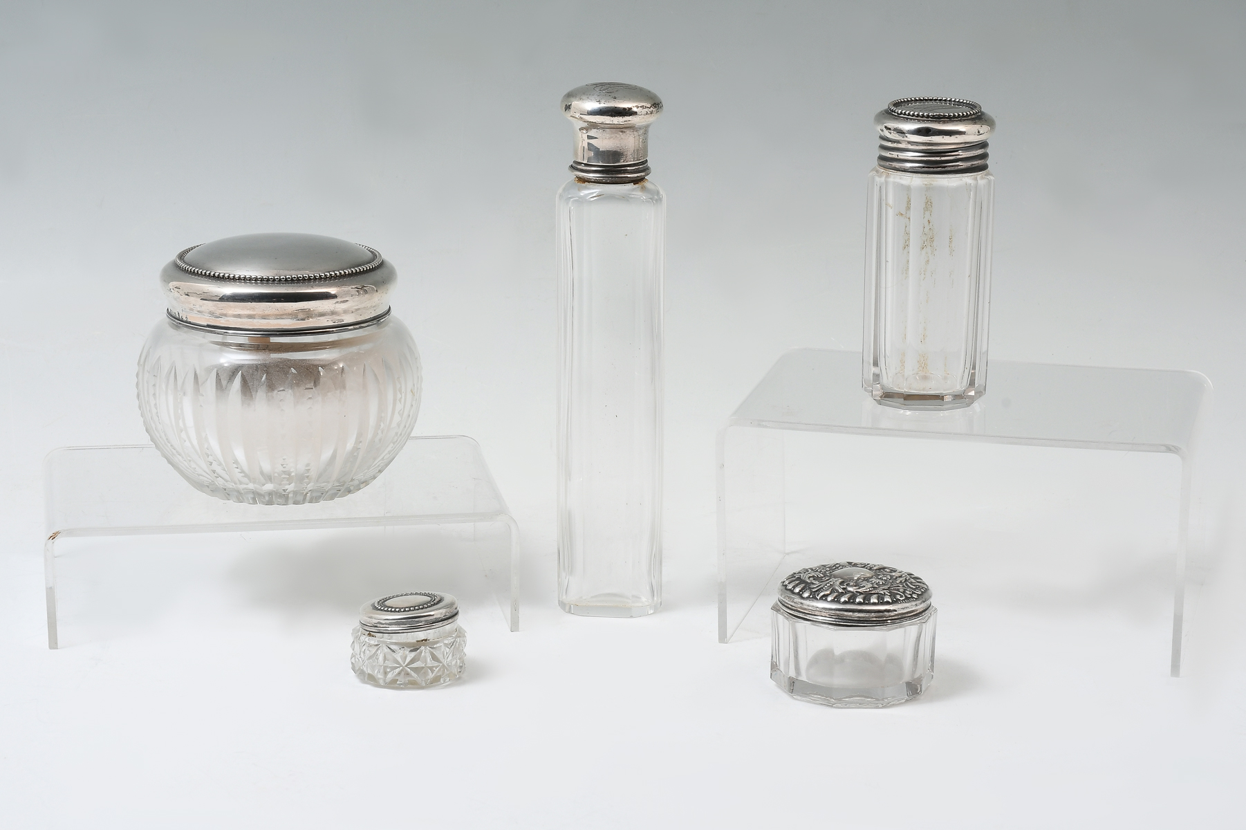 Appraisal: CUT GLASS VANITY BOTTLES WITH STERLING glass crystal dresser bottles