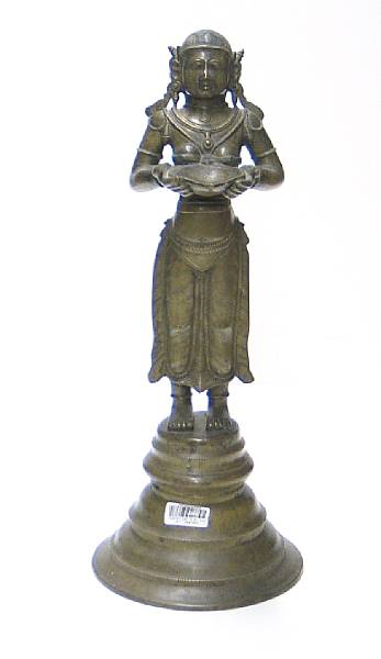 Appraisal: A South Indian brass lamp Cast in the shape of