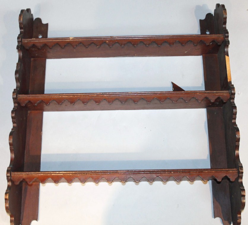 Appraisal: A set of thC mahogany hanging shelves each with castellated