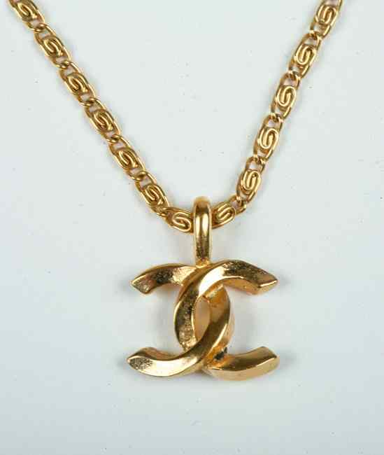 Appraisal: CHANEL GOLD TONE LOGO PENDANT NECKLACE