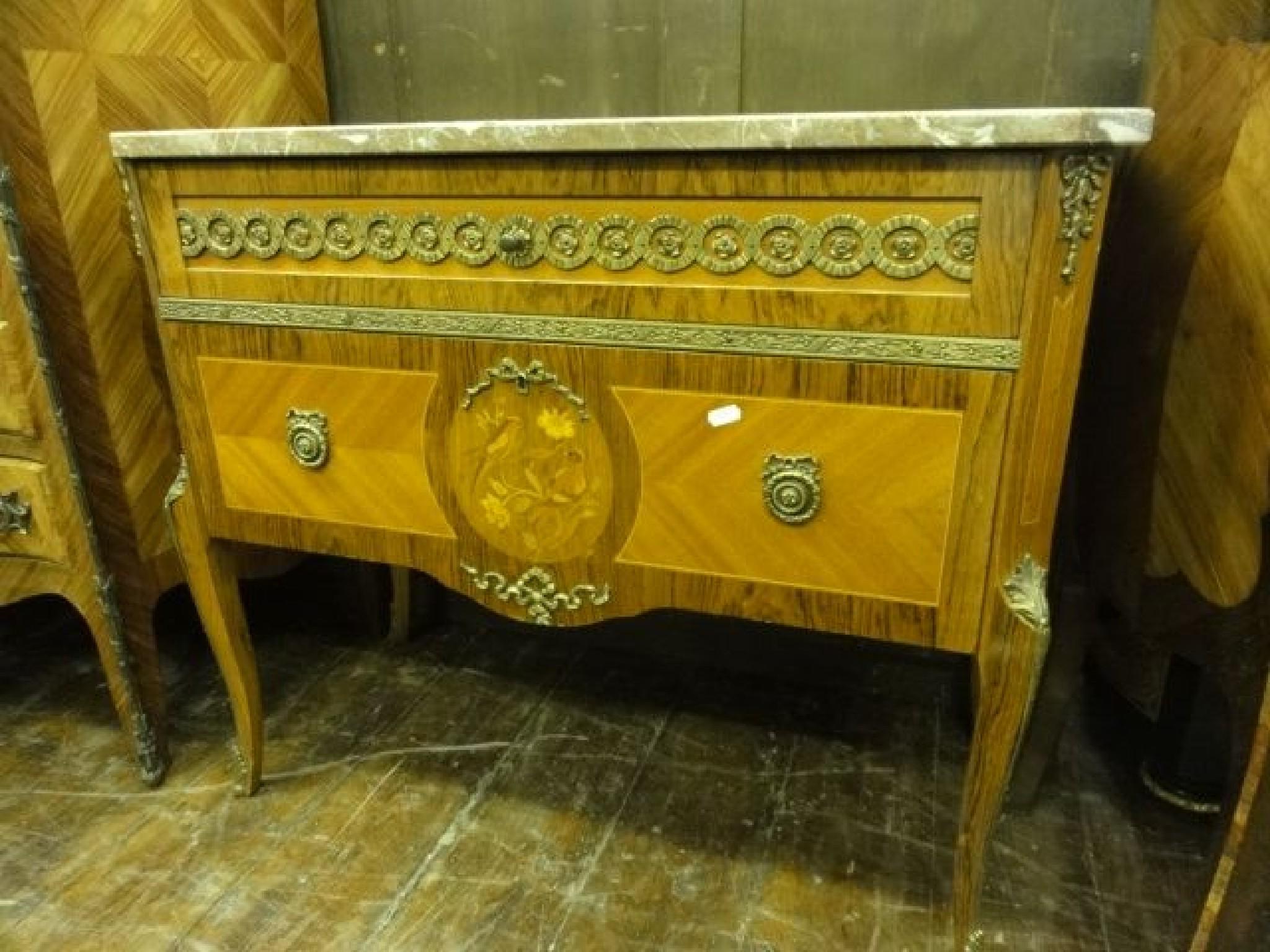 Appraisal: A Louis XV style commode with marble top over two