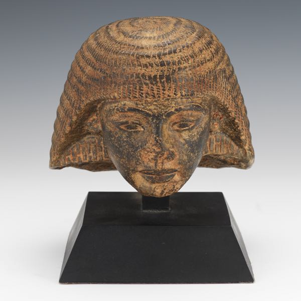 Appraisal: EGYPTIAN CARVED STONE HEAD OF AN OFFICIAL H x W