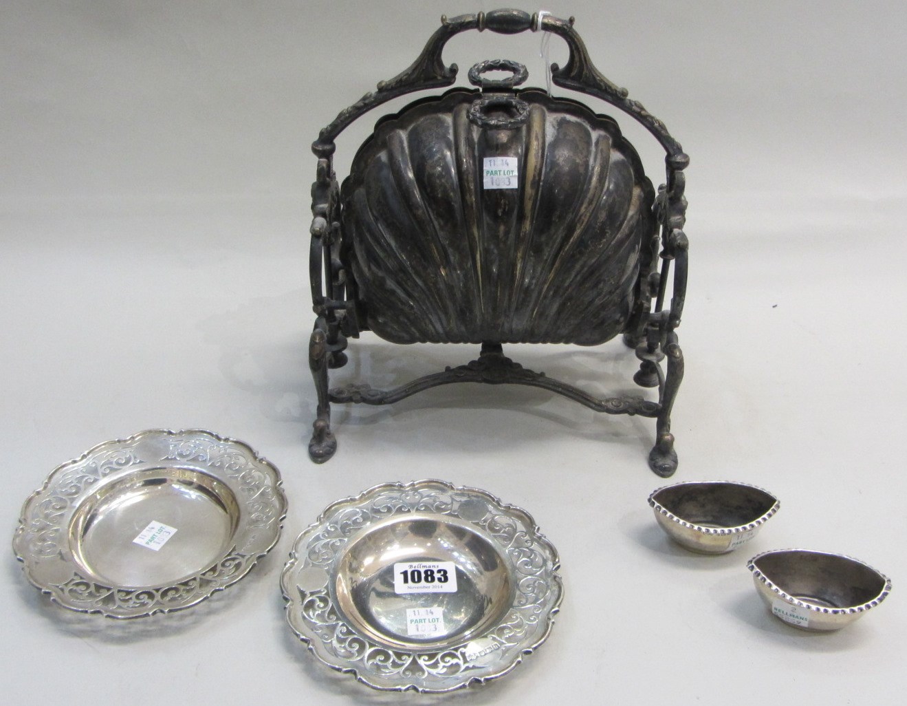 Appraisal: Two similar silver shaped circular butter dish stands decorated with