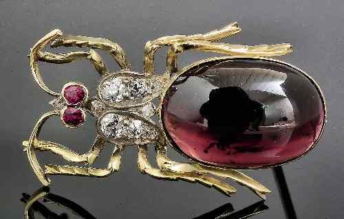 Appraisal: A late Victorian gold coloured metal mounted garnet and diamond