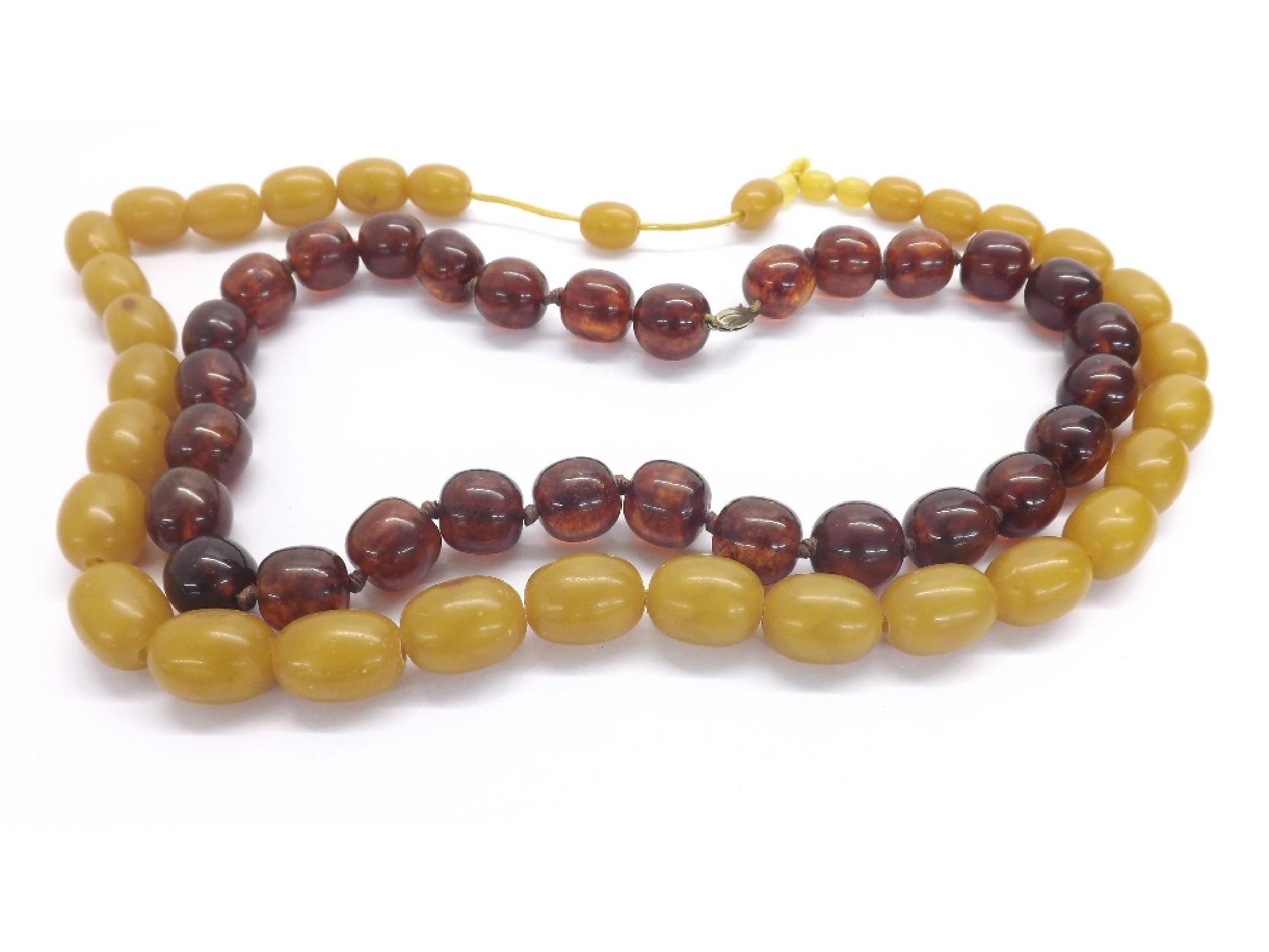 Appraisal: Cherry amber bead necklet gm long also a toffee caramel