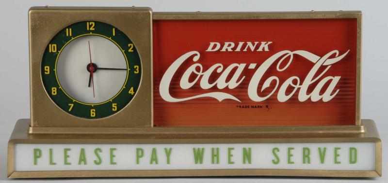 Appraisal: s Coca-Cola Light-Up Clock Description Working Lights up in three