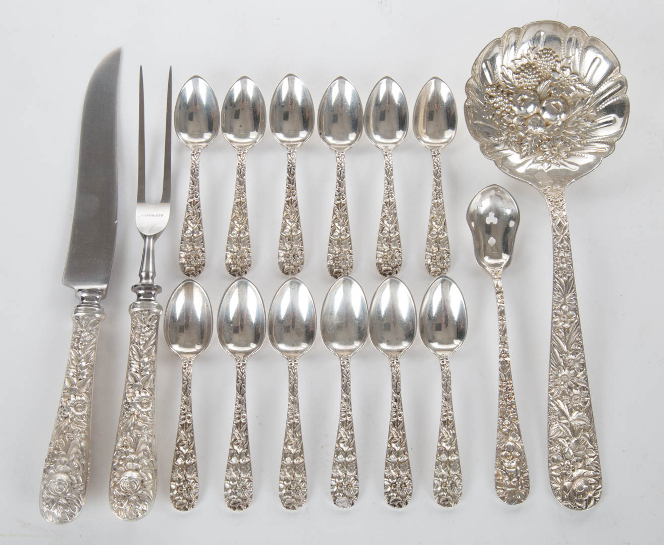 Appraisal: Kirk Repousse sterling berry spoon carving set together with Kirk