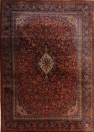 Appraisal: KASHAN MEDALLION CARPET The oblong scalloped ivory medallion anchored to