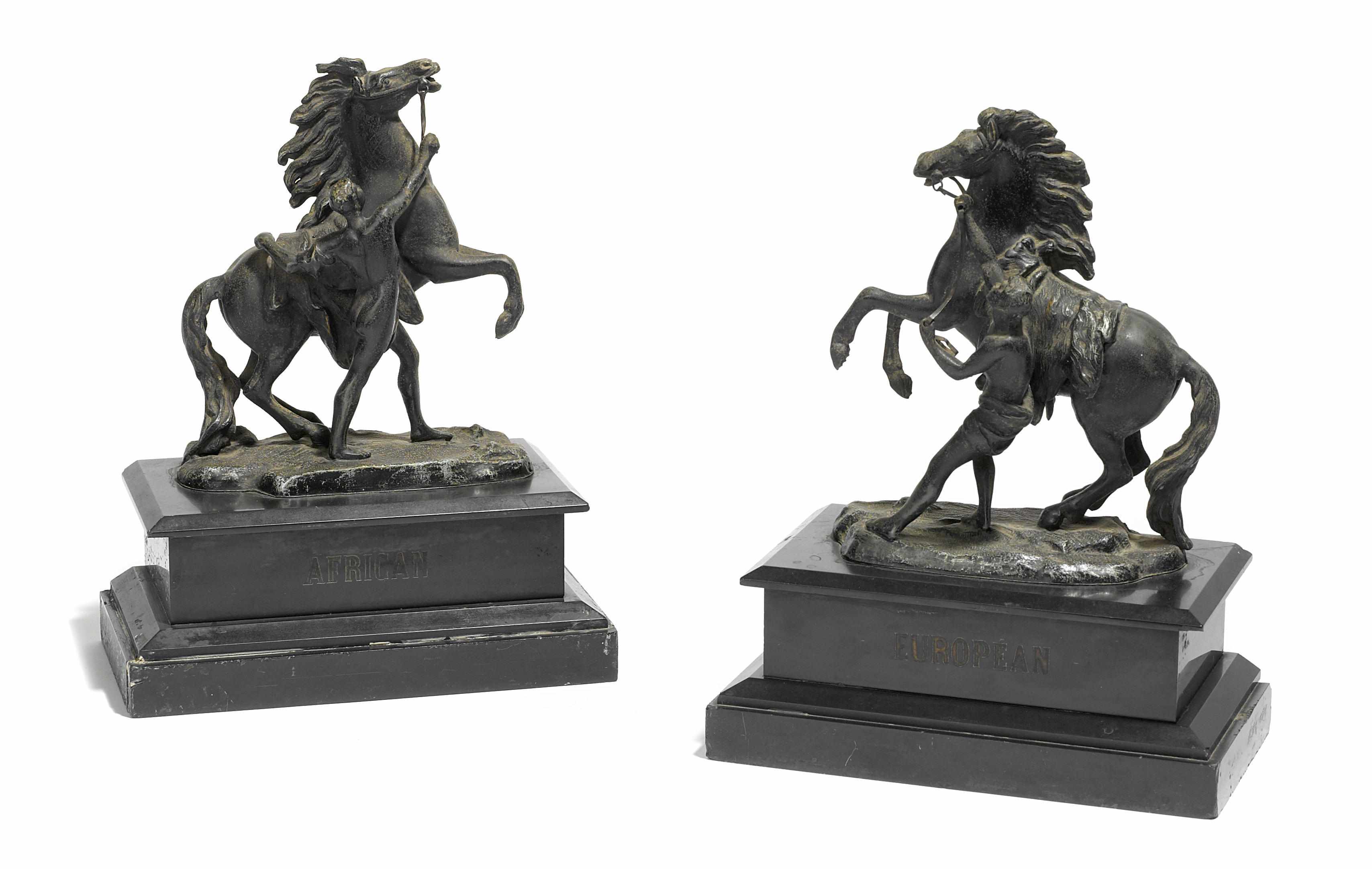 Appraisal: A pair of patinated metal and slate bookends featuring figures