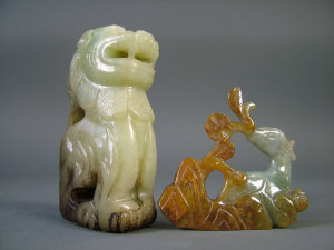 Appraisal: A Chinese variegated green jade figure of a lion height