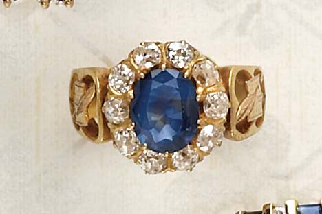 Appraisal: SAPPHIRE AND DIAMOND RING k yellow gold with open book